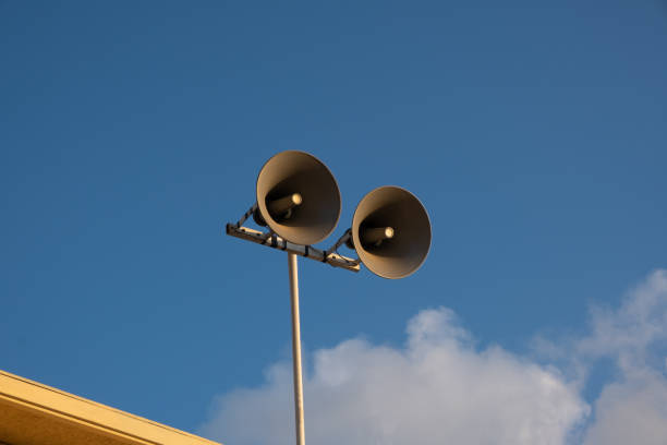 Loudspeakers attached to a tall pillarack, rack, hazard warning system. Providing security in the city, notification of emergencies. Loudspeakers attached to a tall pillarack, rack, hazard warning system. Providing security in the city, notification of emergencies. loudon stock pictures, royalty-free photos & images