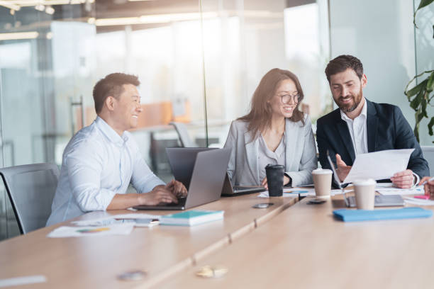 istock Creative business team working on project in modern office with panoramic view 1419138000