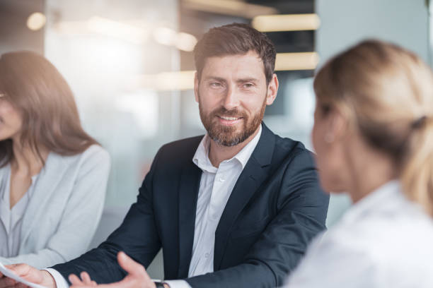 istock Confident and successful team. Group of modern people are working together in office 1419138064
