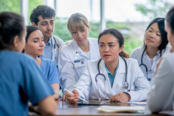 istock Boardroom Meeting with Doctors and Nurses 1419141162