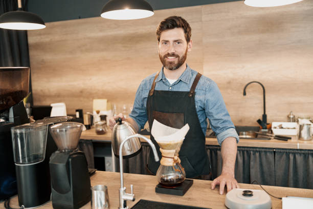 istock Man barista making filter coffee in cafeteria 1419141406