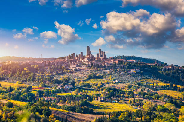 town of san gimignano, tuscany, italy with its famous medieval towers. aerial view of the medieval village of san gimignano, a unesco world heritage site. italy, tuscany, val d'elsa. - san gimignano imagens e fotografias de stock
