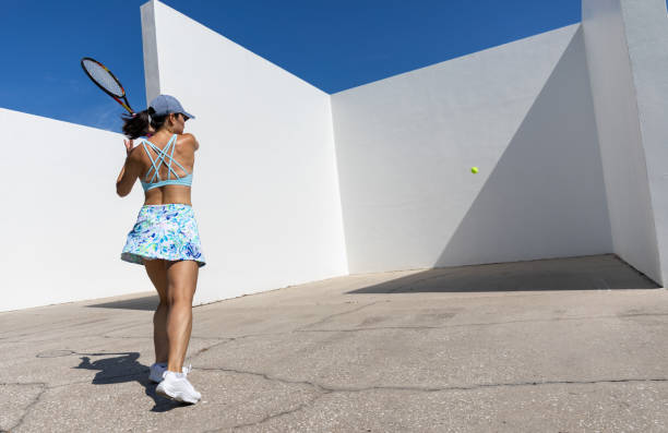 istock Female tennis player practicing on handball court 1419143747
