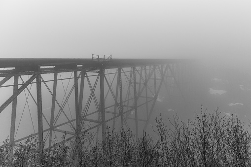 Railroad bridge in fog in Alaska