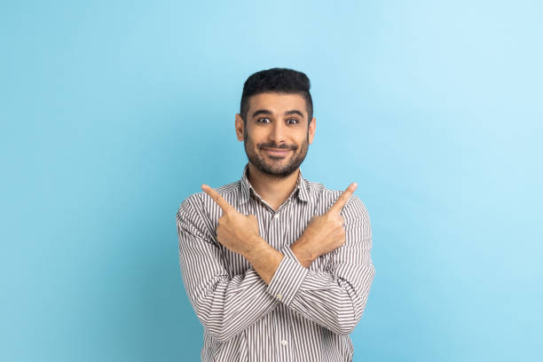 istock Businessman pointing both sides, showing blank copy space for idea presentation, commercial text. 1419143937