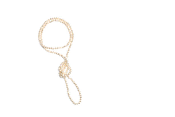 istock Pearl necklace on a white background with copy space 1419144480