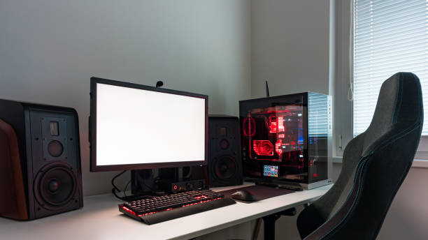 istock Powerful personal computer gamer rig with white screen. Professsional gaming empty room studio with neon lights and RGB powerful computer, keyboard and mouse. White screen on pc display. 1419145263