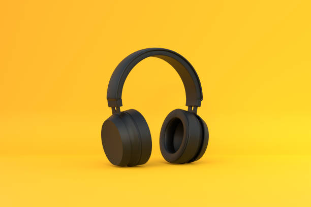 istock Wireless headphones on a yellow background 1419145306