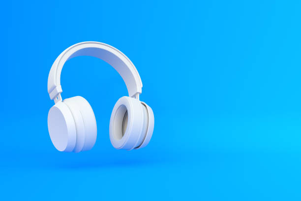 istock Wireless headphones in the air on a blue background 1419145356