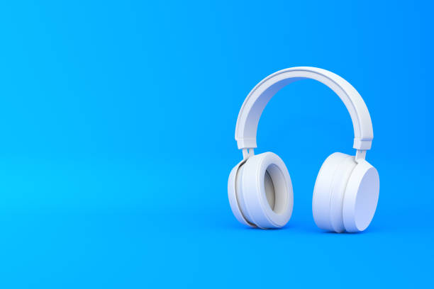 istock Wireless headphones on a blue background 1419145416