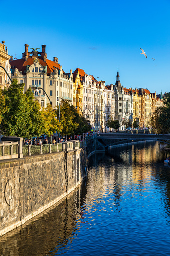 Old Town of Prague in Czechia. Prague, Czech Republic. Vltava River and old buildings across the river. Concept of world travel, sightseeing and tourism.