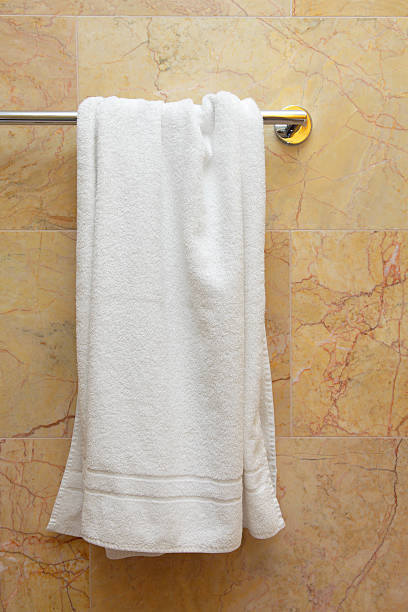 istock A white big towel is hanging from a rack 141914589