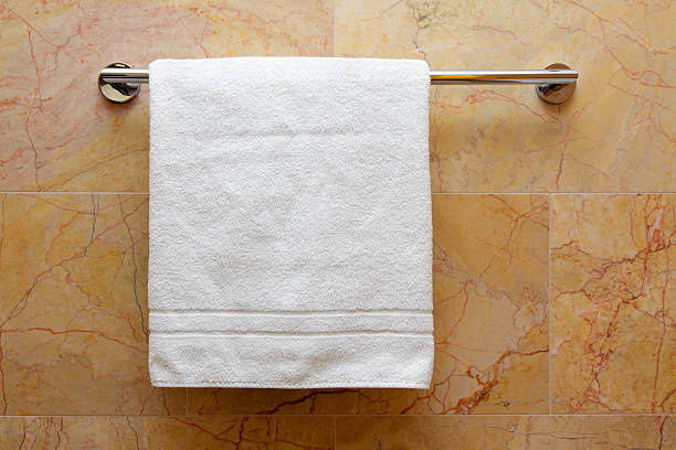 istock White towel on hanger with marble background 141914594