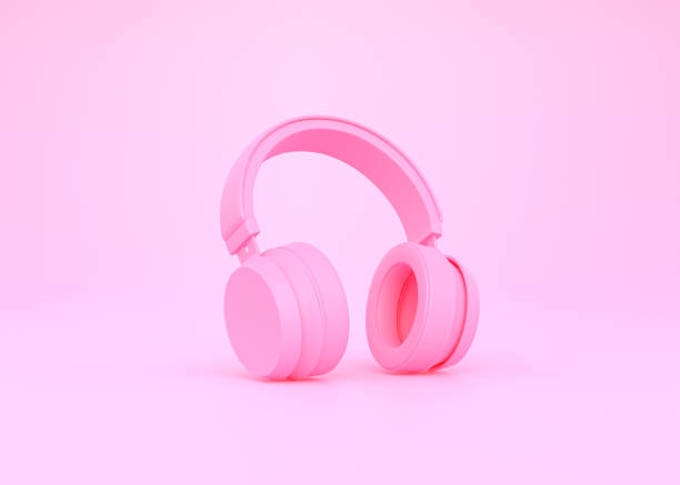 istock Wireless headphones on a pink background 1419146224