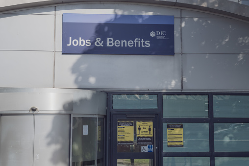 Belfast, Northern Ireland, United Kingdom - August 27, 2022:  The entrance of a Jobs and Benefits branch office, operated on behalf of the Department for Communities of the Northern Ireland government.