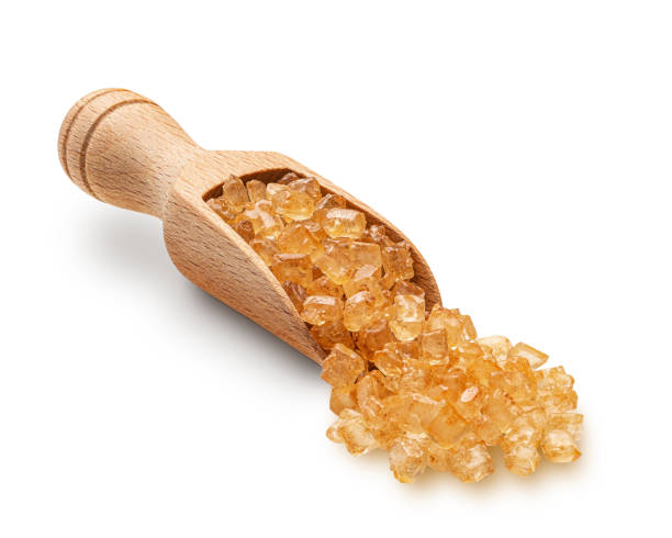 istock Large brown sugar crystals scuttered from wooden scoop 1419152247