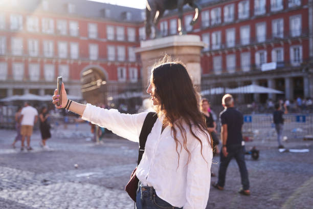 istock Happy caucasian woman is taking a selfie 1419155283