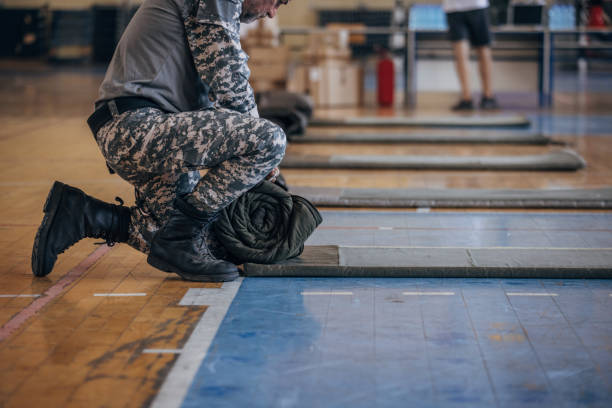 istock Soldier preparing sleeping bags for civilians 1419155936