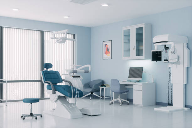 Modern Dental Office Interior of an empty modern dental clinic room. dentists office stock pictures, royalty-free photos & images