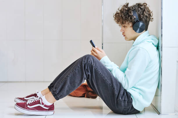 istock Depressed Teenage Boy in School 1419157216
