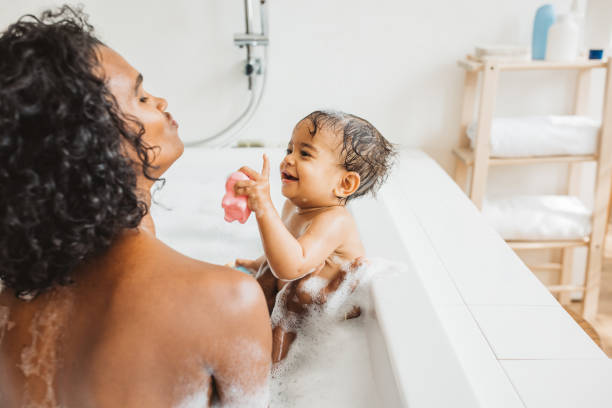istock Mother and baby bathing 1419157320