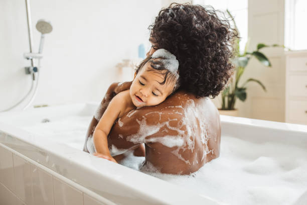 istock Mother and baby bathing 1419157322