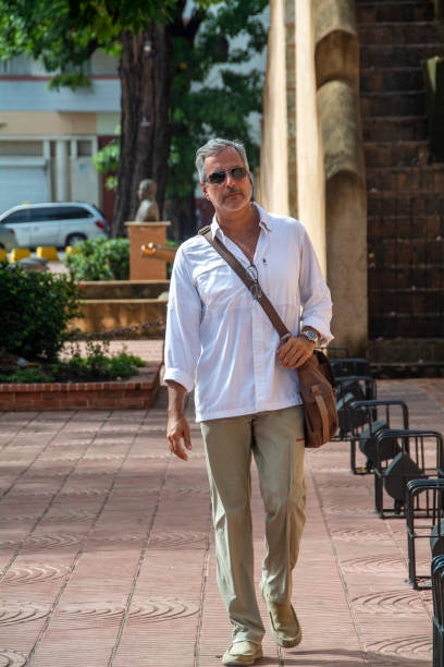 istock Mature man walking around town 1419158435