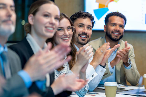 istock Group of business people applauding a presentation. 1419159357