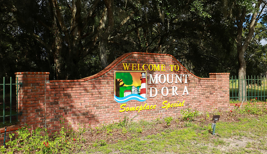 Mount Dora, Florida, USA:  Welcome to Mount Dora sign at the entrance to the family oriented lakeside town as seen on October 25, 2020.