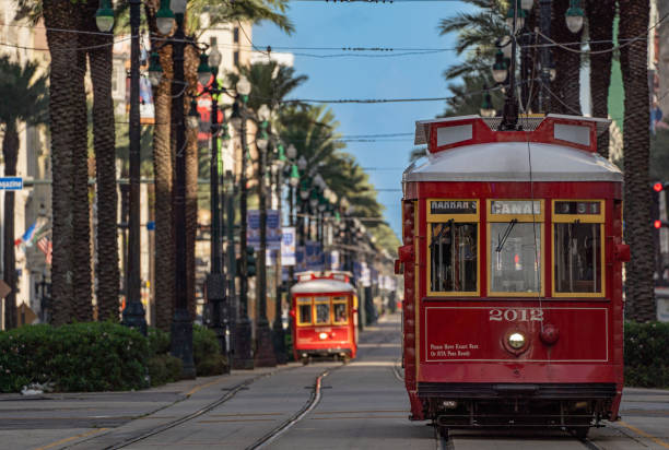 The Famous Red Trolleys on the Canal Streetcar Line in Downtown New Orleans, Louisiana stock photo