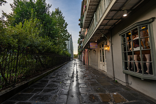 New Orleans, Louisiana, USA - August 13, 2022: Pirates Alley which leads to Jackson Square in the French Quarter of New Orleans, Louisiana