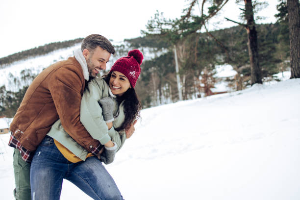 istock Cheerful couple enjoying their winter vacation 1419168235