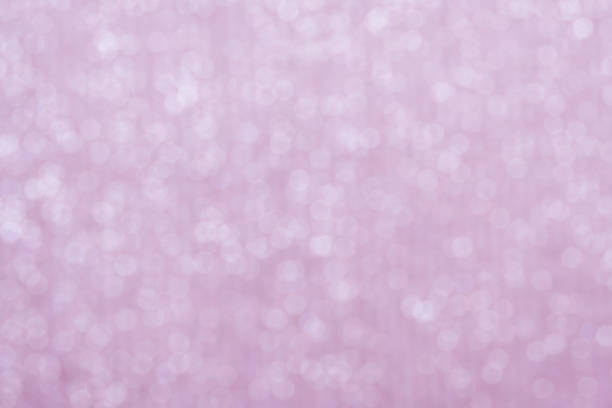 Pink bokeh circle abstract shining background. Blurred glittering wallpaper.