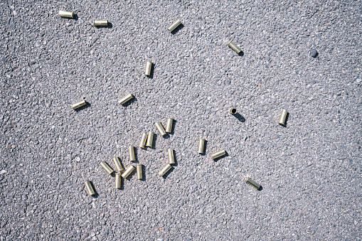 Bullet casing on asphalt