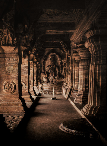 Interior look of Badami cave 3, is the largest and the most well-maintained cave out of the four rock-cut caves in Badami, Karnataka, India. This cave is dedicated to God Vishnu.