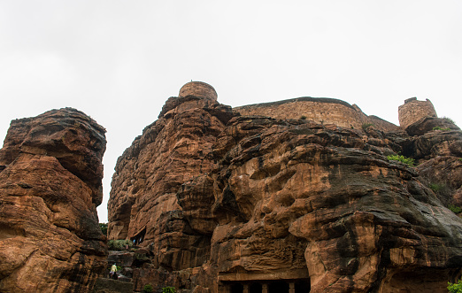 Low angle shot of Badami rocky mountains with first cave.