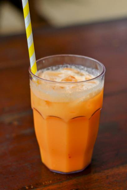 istock Iced mango juice in a transparent glass with paper straw. 1419181330