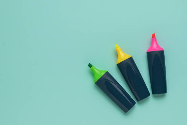 istock Green, yellow and red marker on a light blue background. Flat lay. 1419185360