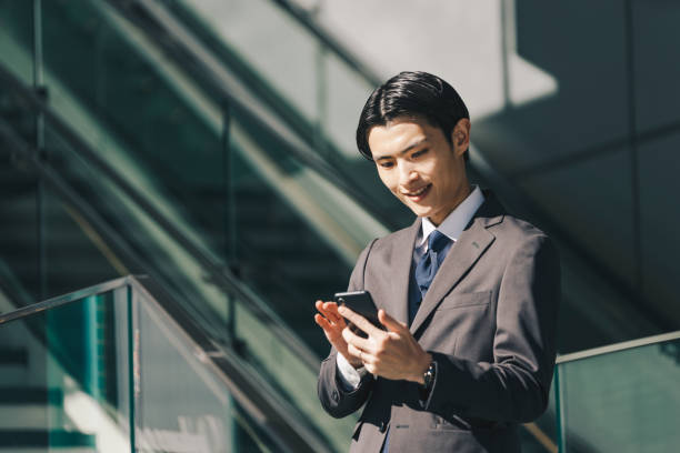 istock Male businessman operating a smartphone 1419186021