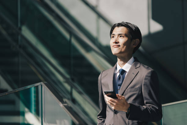 istock Male businessman operating a smartphone 1419186024
