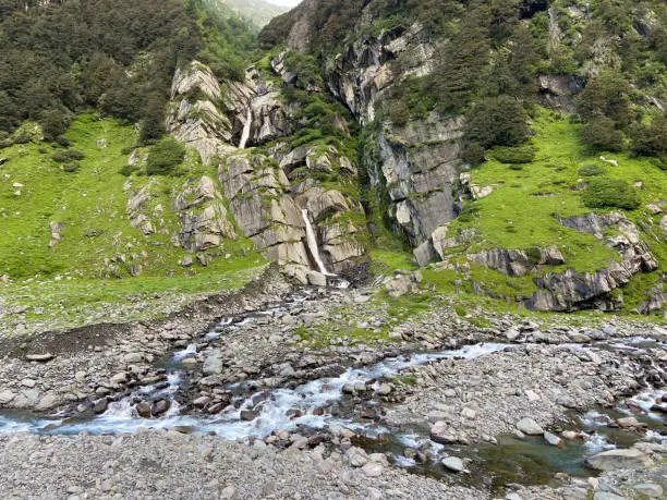 Water from waterfall joining Uhl river in barot valley, Himachal pradesh, India.