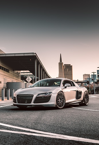 Seattle, WA, USA\nAugust 20, 2022\nSilver Audi R8 parked with a building in the background