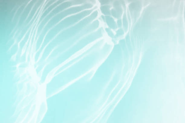 istock Defocus blurred transparent blue colored clear calm water surface texture with splashes and bubble. Trendy abstract nature background. Water wave in sunlight with copy space. Blue watercolor shining. 1419203883