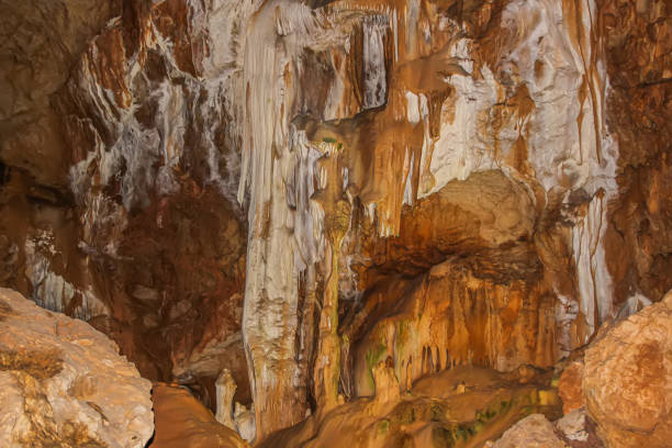 istock Abstract drawing of an underground cave with stalactites and stalagmites. Limestone karst formation. Travel and vacation concept. Digital painting. Abstract naturalism, relief pattern. 1419203966