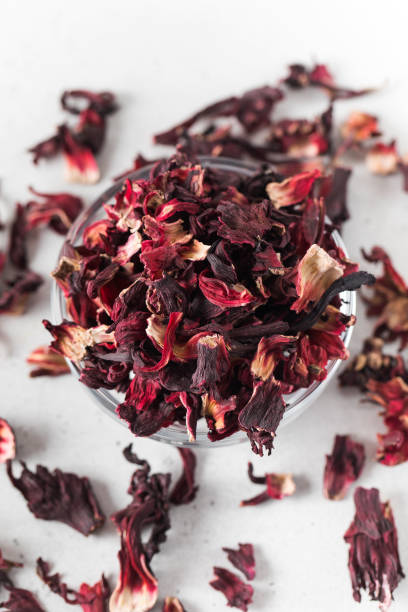 istock Dry hibiscus petals for making fragrant tea on a light background close-up. 1419204060