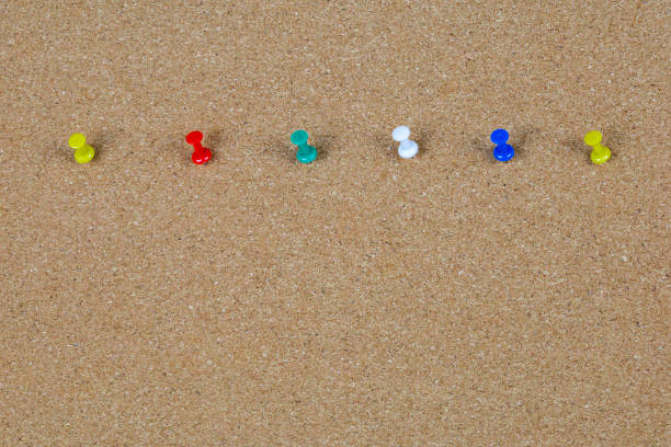 istock a colorful pins on a wooden board. 1419206897