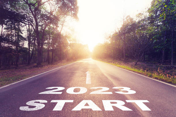 istock Empty asphalt road and New year 2023 concept. Driving on an empty road to Start 2023 with sunset. 1419210522