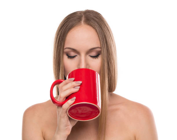istock A beautiful woman with a red cup. 1419214357
