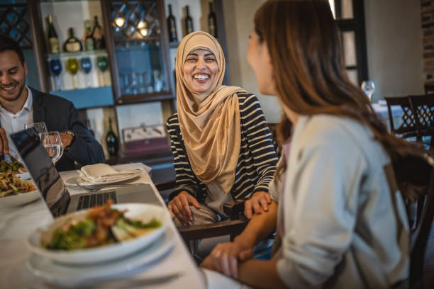 istock Multi-ethnic business colleagues eating lunch in a restaurant 1419218421