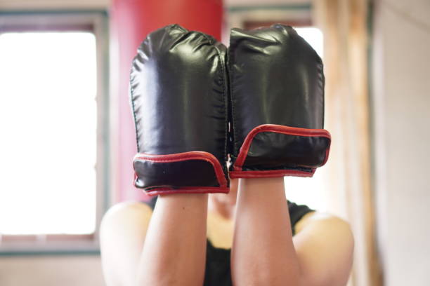 istock Sport: Female boxer warm-up for home workout, exercise at home, close up. 1419224190